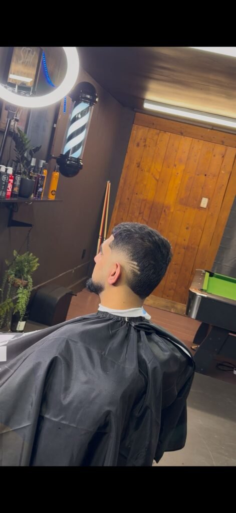 Mid skin fade with line detail, men's haircut in Papakura, Auckland